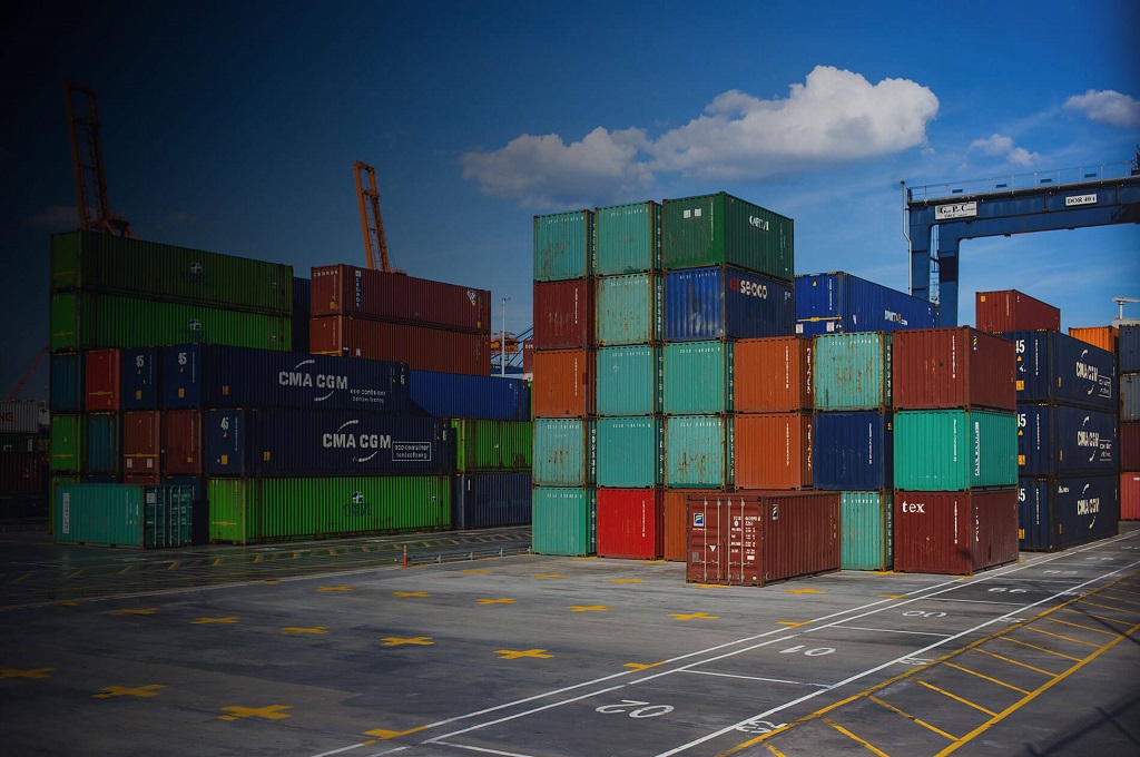 Marine Insurance web page Featured Image - Picture of cargo containers stacked on a shipping dock.